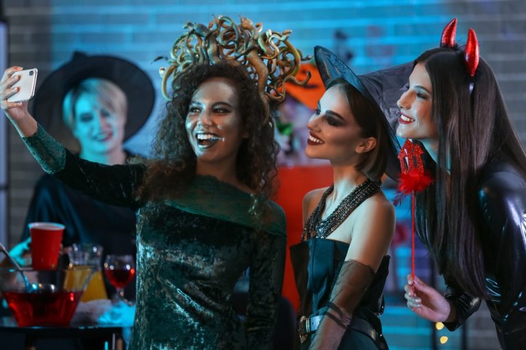 Young women taking selfie at Halloween party